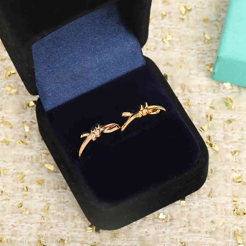 

T home knot ring female V gold high version 18k rose intertwined smooth belt drill