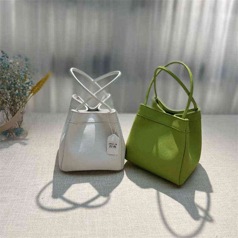

Handbag Heat leather bucket lychee pattern soft portable leisure sling Shoulder Messenger women's, White