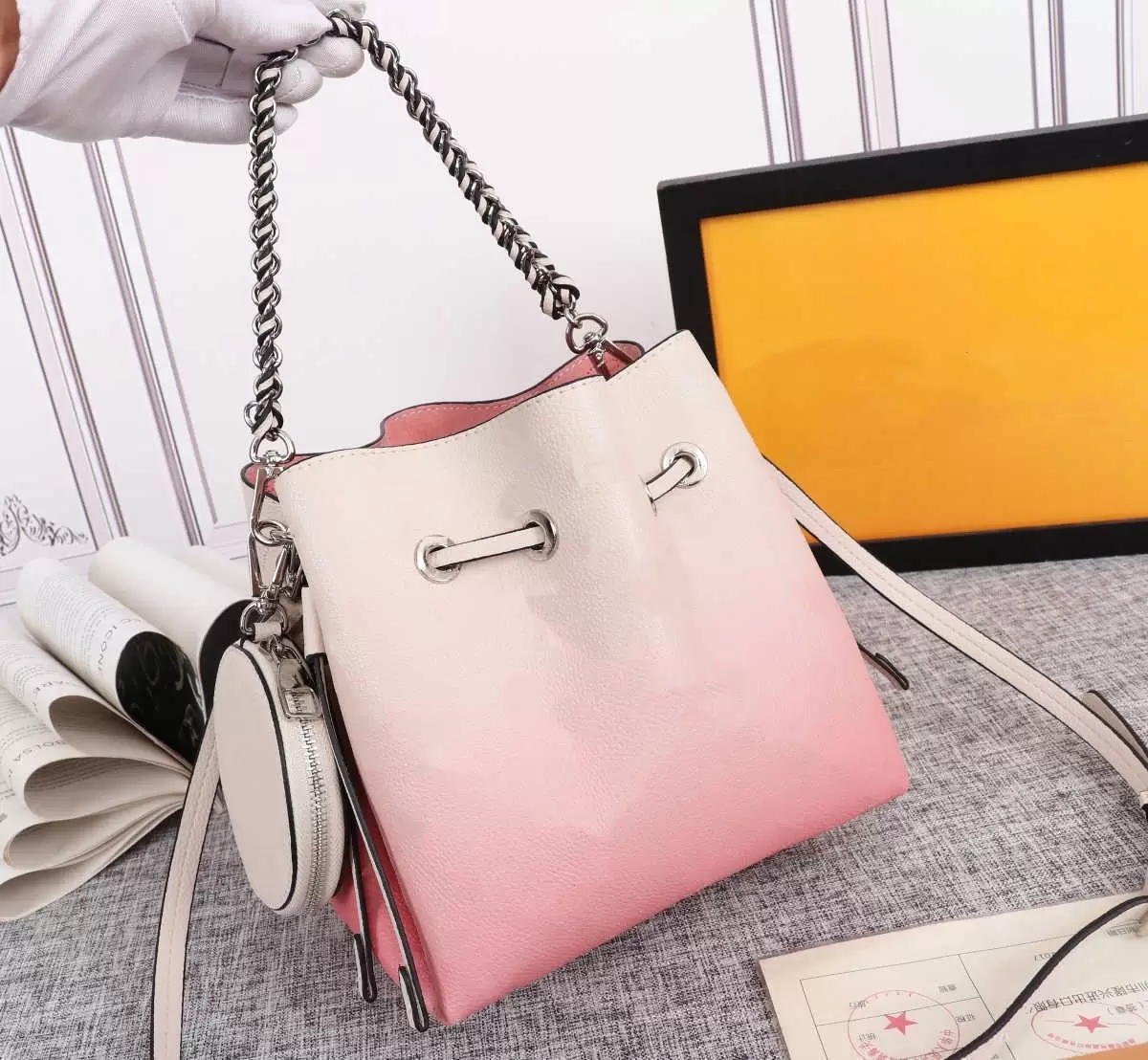 

HH Bella Tote 22SS Mahina Drawstring Bag Perforated Calf Hollow Out Leather Chain Handbag Women Luxury Designer Organized Handle Bucket Bags Large Capacity, Add shipping fee