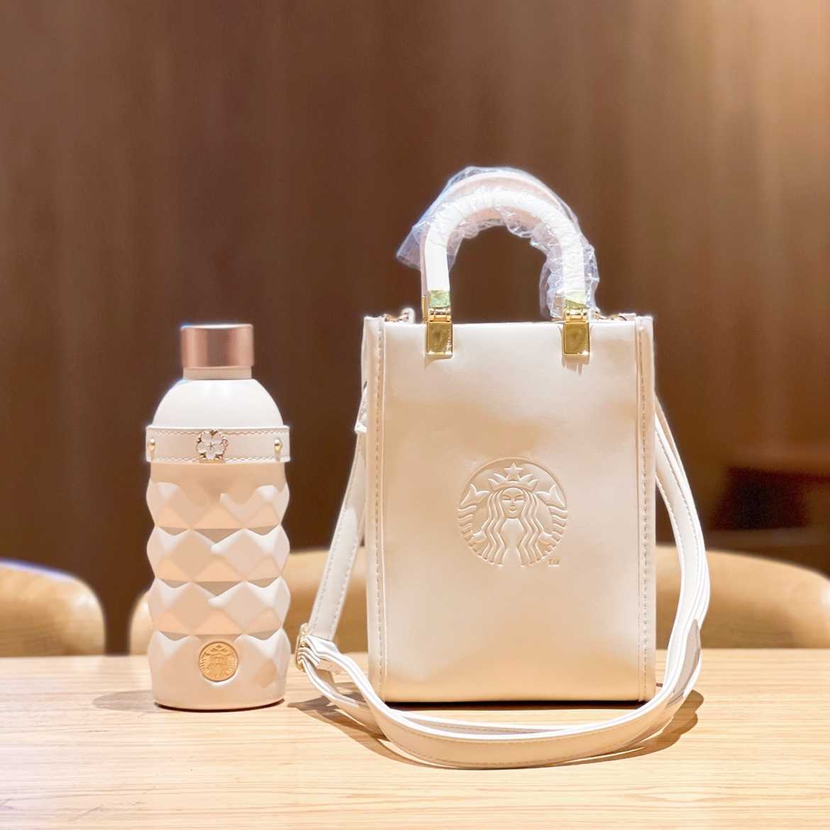 

Starbucks 2022 Cherry Blossom milk white cut stainless steel traveling cup thermos cup with handbag, Yellow