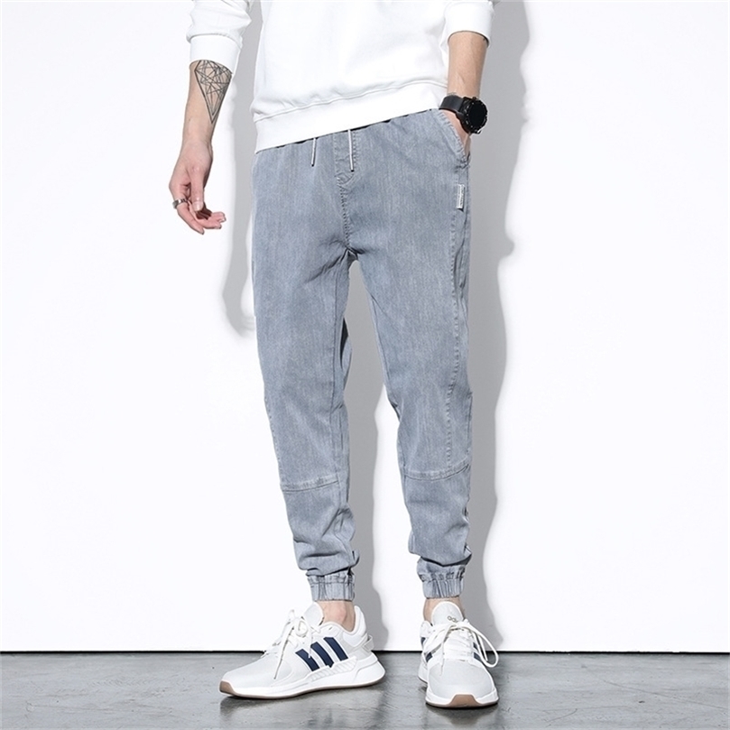 

Summer Autumn Style Jeans Men Slim Jeans Pants Mens Black Denim Trousers Zipper Blue Hole Pencil Pants Jeans 201128