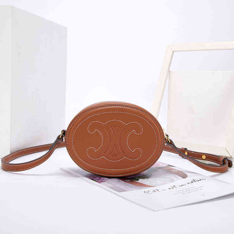 

Factory Direct Sale New Brand Ladies Bags Wholesale Fashion Shoulder Triumphal Arch Pig Nose Leather Small Round Mini Messenger Mobile, Black