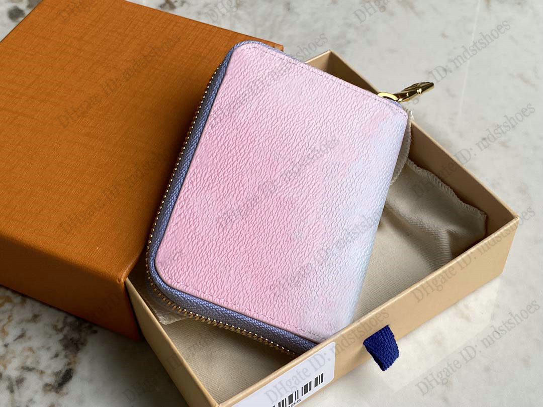 

Spring in the City Collection Zippy Wallet Mini Clutch Bag By the Pool Sunrise Pastel Color Gradient Oversized Canvas Limited Edition Luxurys Purse M81388