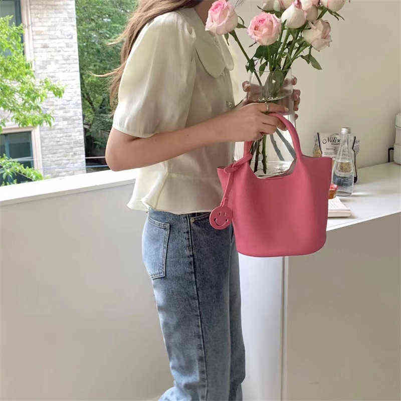 

Handbag Heat leather smiling face bucket portable messenger version simple leisure women's, White