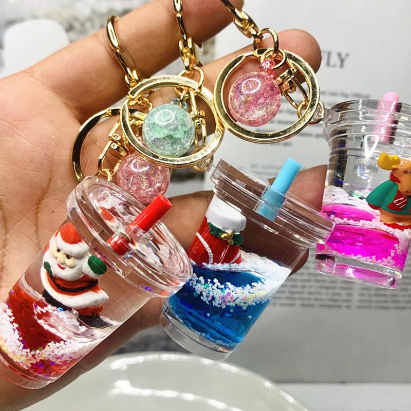 

Keychains 1PCS Christmas Acrylic Snowman Car Bag Pendant Keyring Milk Cup Oil Liquid Quicksand Tree Stockings Jewelry Gift