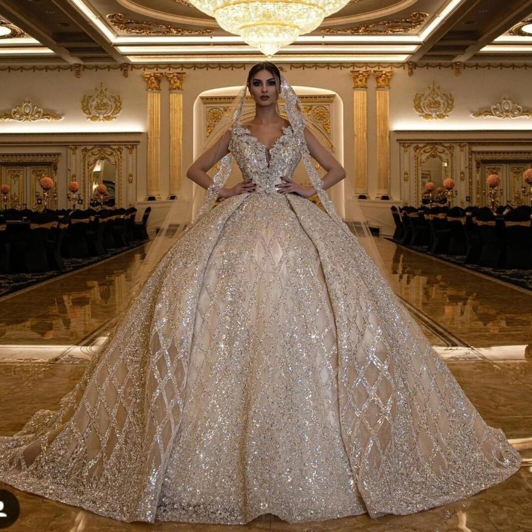 2022 Luxury Sparkly Gold Sequined V neck Wedding Dresses Bridal Gowns Arabic Dubai Sleeveless Pleats Vintage Cathedral Train Bride Gown Custom Ma
