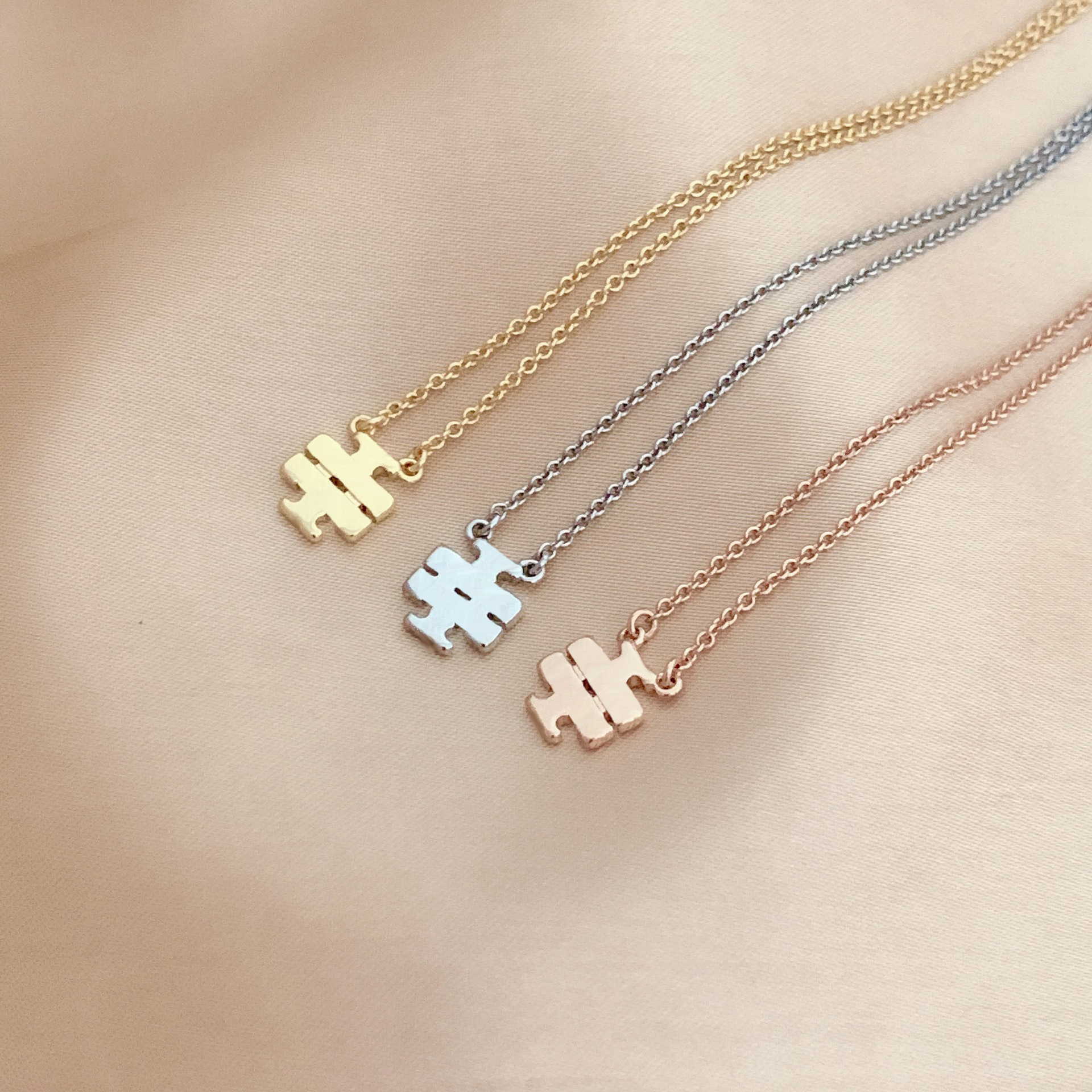 

Curved Crosses Earrings & Necklace Set in Gold Silver & Pink Brass