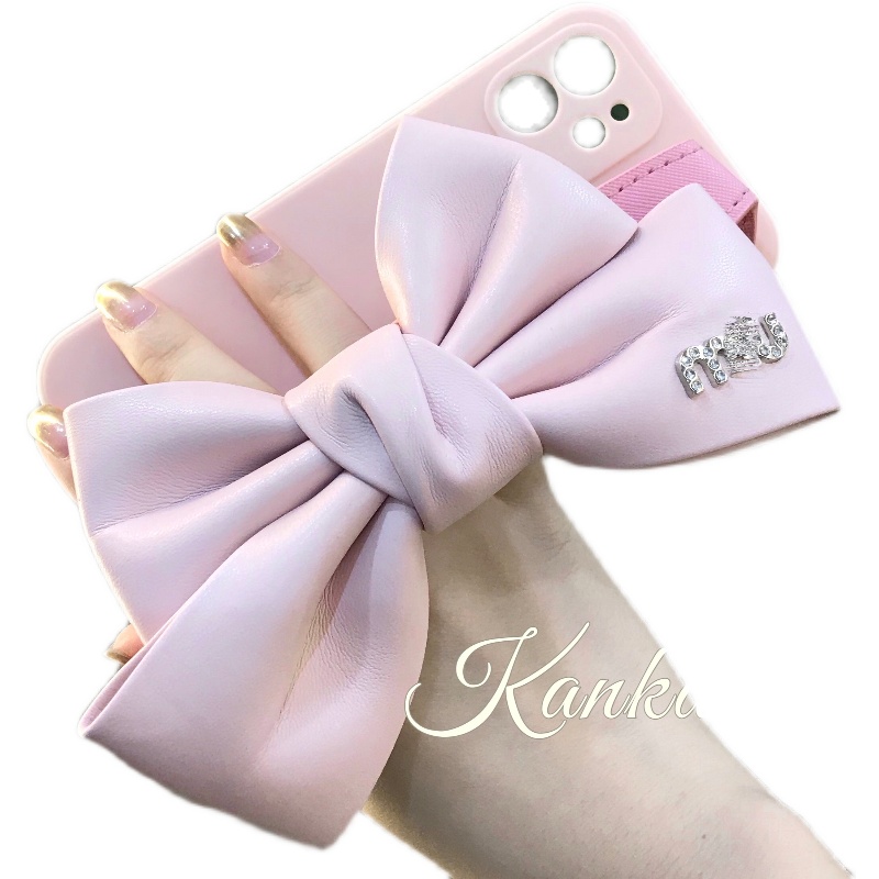 Étuis de téléphone portable rose de marque à la mode, étui de téléphone avec sangle à nœud pour iphone