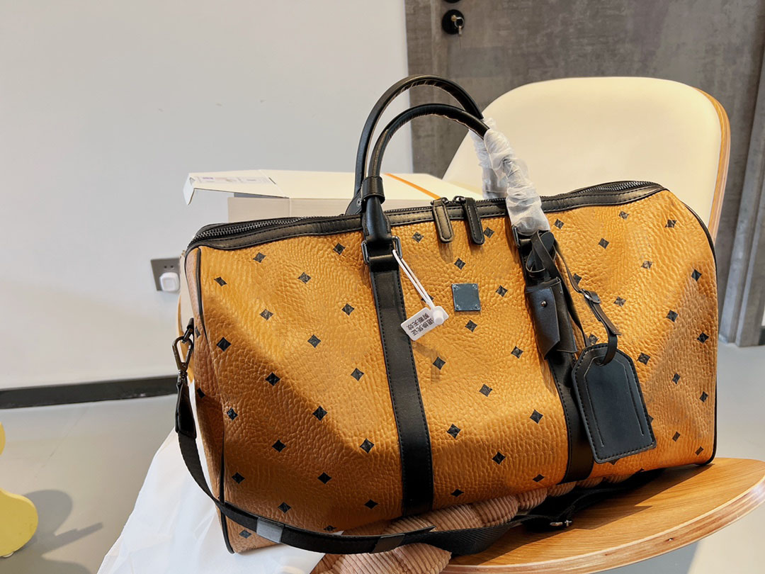 Designer de luxe Duffle Bag hommes femmes Top Qualité jaune original en cuir Sacs de Voyage Grande Capacité épaule Bandoulière Bagages Sac Totes