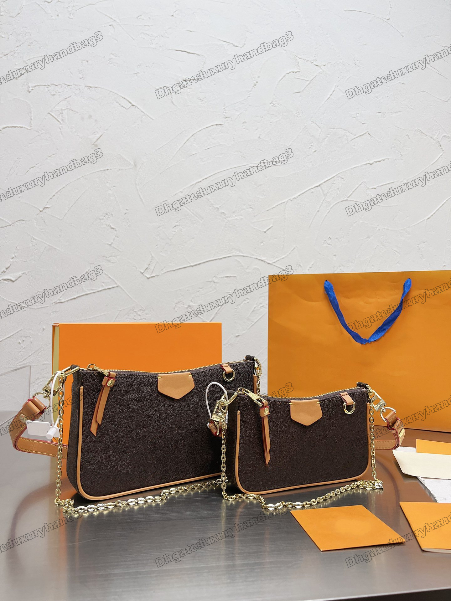 

2022ss New Easy Pouch On Strap Shoulder Bags Embossed Monograms Empreinte Leather Sleek Design Black Creme White Small Women Luxurys Designers Bags