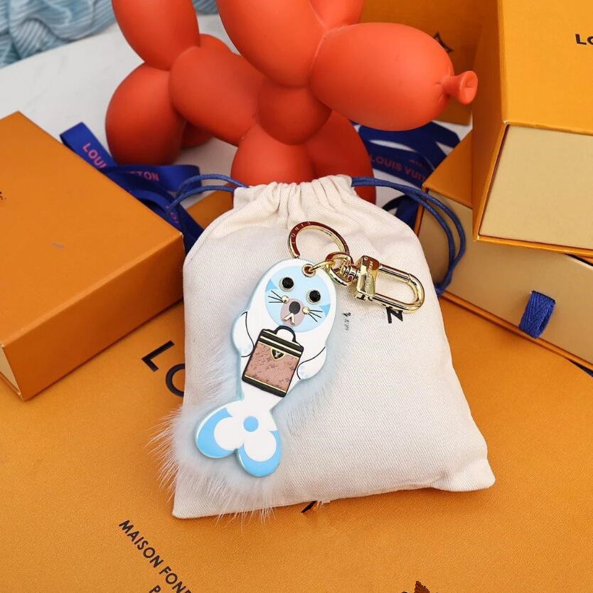 

Designer Coulples Sunflower Key Wallet Luxury Brand Fawn Sea Lion Hairball Shoulder Bag Totes Luggage Pendant Brand Keychain Women Men Penguin Car Keyring Gift
