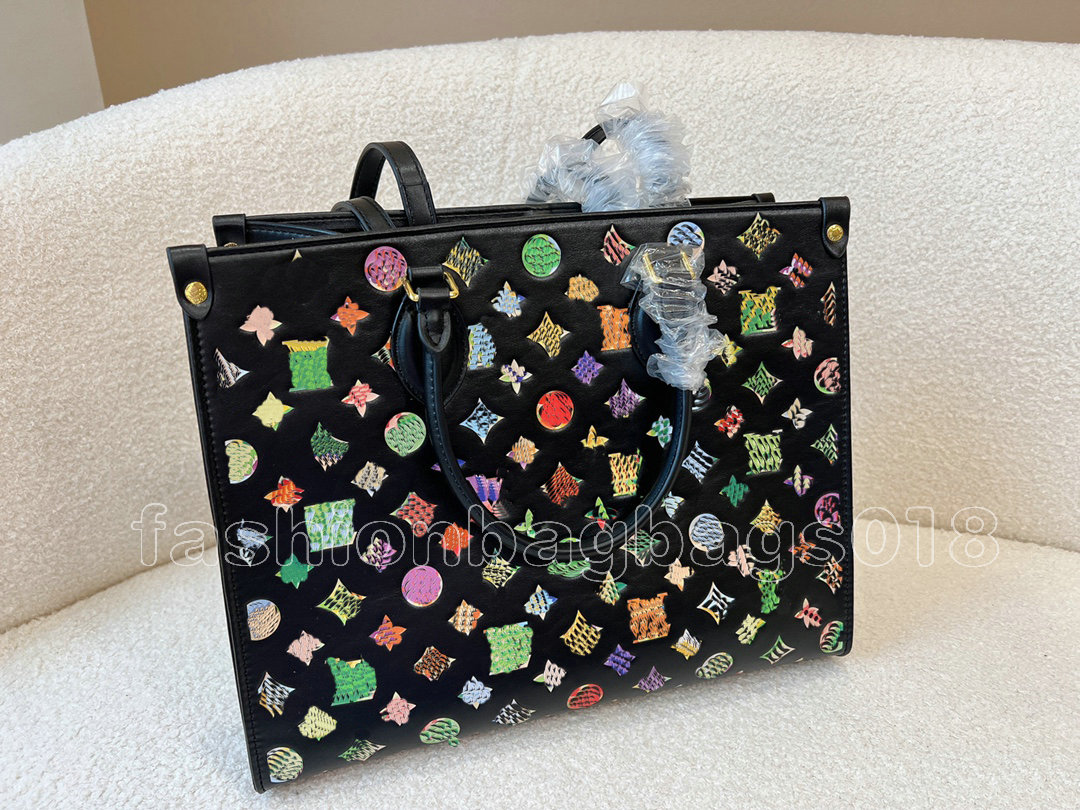 

on the go mm 2022 fallwinter series shopping bag embossed flowers monograms pattern designers totes