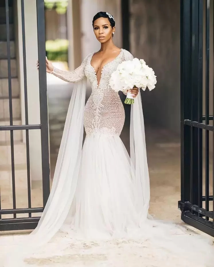 

Luxurious Mermaid Wedding Dresses Arabic Aso Ebi Sexy Illusion V Neck Bridal Gowns Lace Beading Crystals With Cape Sweep Train Long Sleeves, Silver