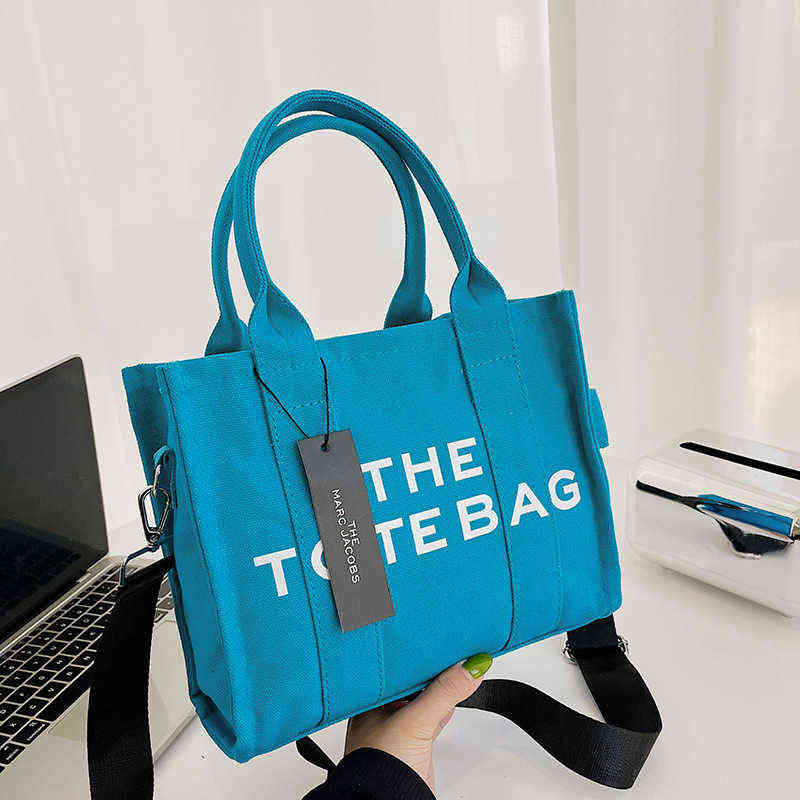 

Handbag 2022 New Summer Tote Bag Simple Solid Color Letter Women's Commuting Large Capacity Messenger Canvas 0722, Beige trumpet