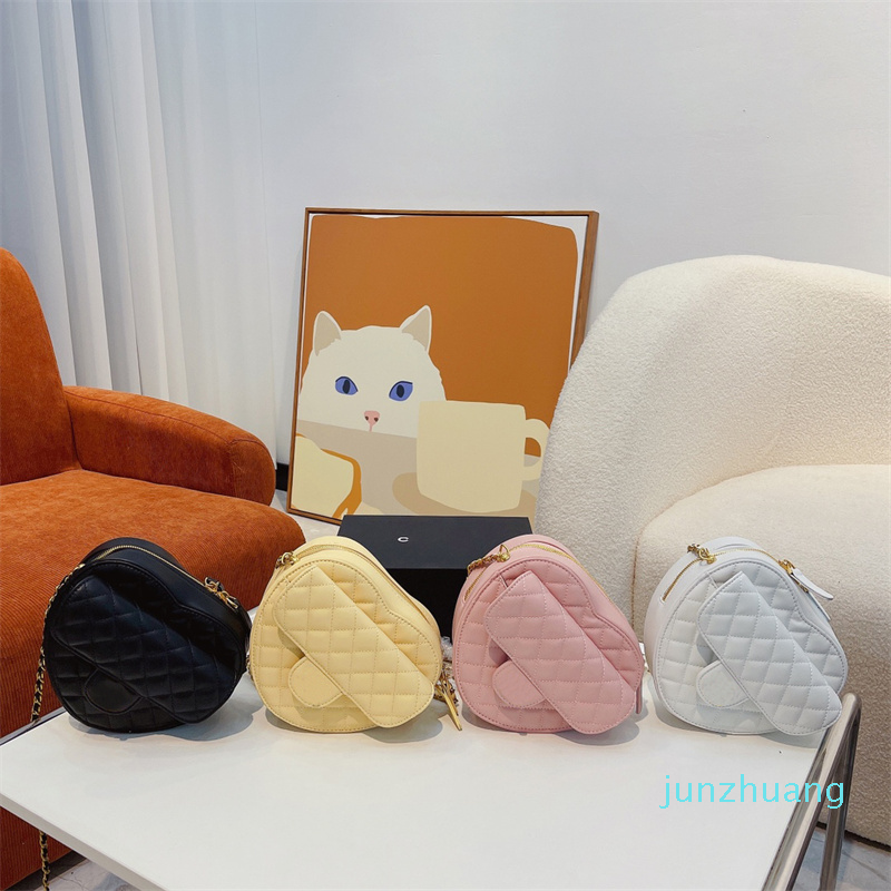 

Designers Bags Luxurys woman Love heart shape shoulder bags Leather handbags temperament versatile messenger bag Metal clasp letter shopping wallet2022, Pink