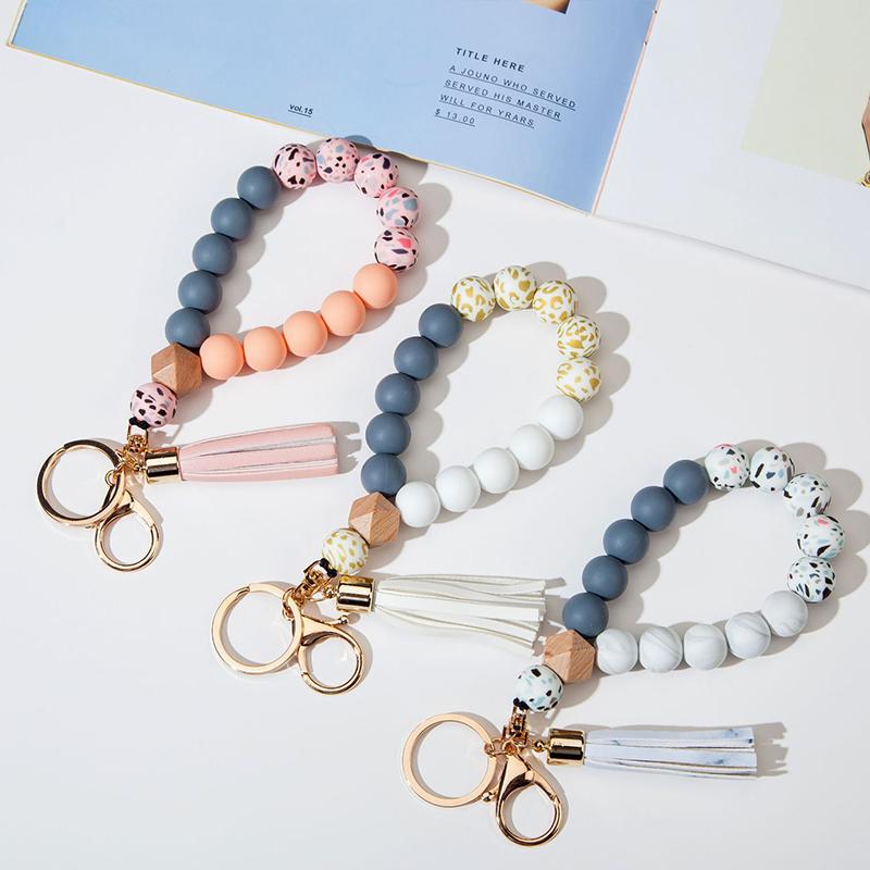 

Keychains 1pcs Silicone Keychain For Women Tassel Wood Beads Wristlet Bracelet Keyring Keys Fashion Jewelry Accessories Wholesale