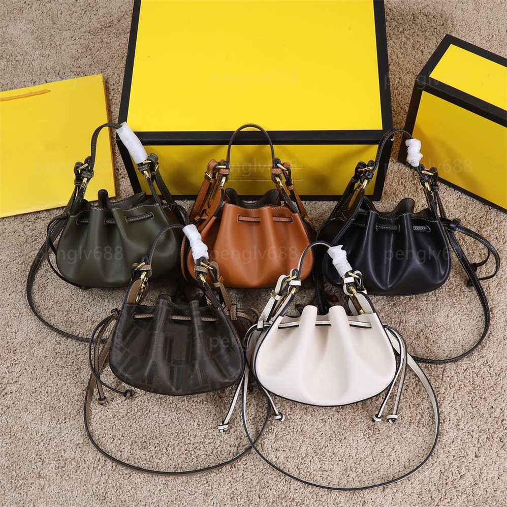 Mini Handbag messenger bag with drawstring closure with interior compartment and gold metal handle or removable shoulder strap