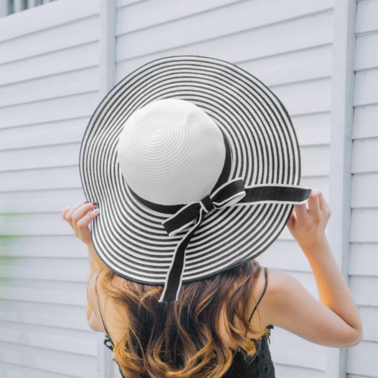 

Women's Wide Brim Sun Hats Floppy Bowknot Beach Style Large Brim Sun Hats Black and White Stripes Shading Hats Foldable for Females LC, Navy blue