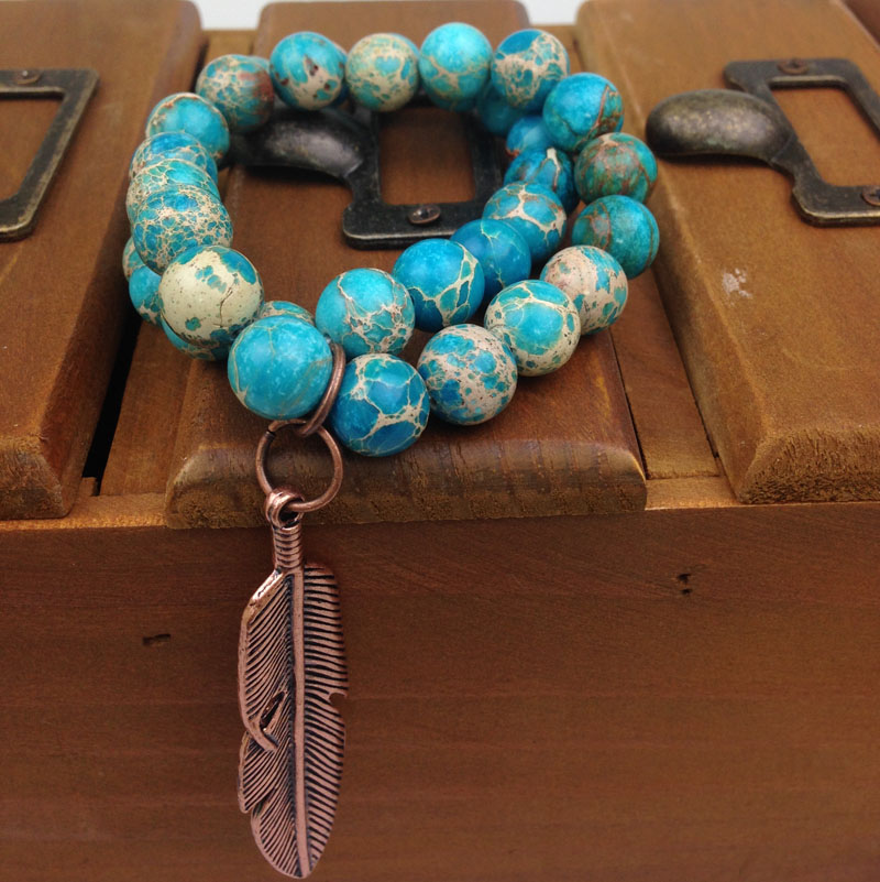 Bracelet ST0188 10mm stretch Real Blue Regalite serti de breloques en plumes de cuivre bracelet de perles de jaspe impérial