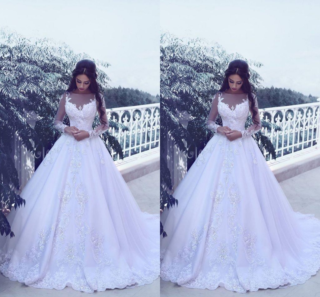 

2017 Arabic Wedding Dresses Jewel Neck Illusion Long Sleeves A Line Lace Appliques Beaded Court Train Tulle Formal Plus Size Bridal Gowns, Ivory