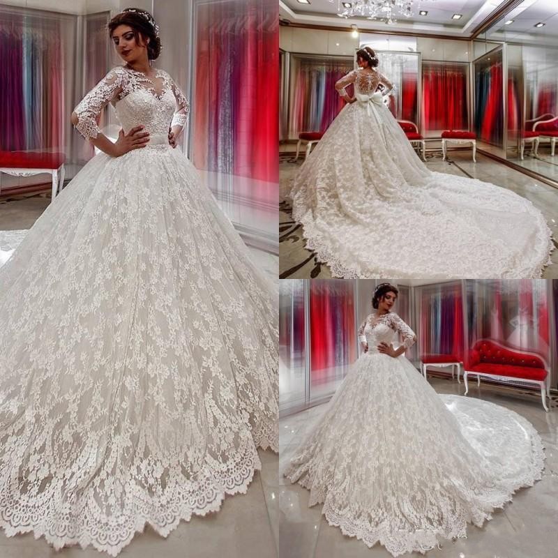 

2017 Ball Gown Wedding Dresses Sheer Neck Illusion Three Quarter Sleeves Lace Applique Beads Open Back Sash Bow Cathedral Train Bridal Gowns, White