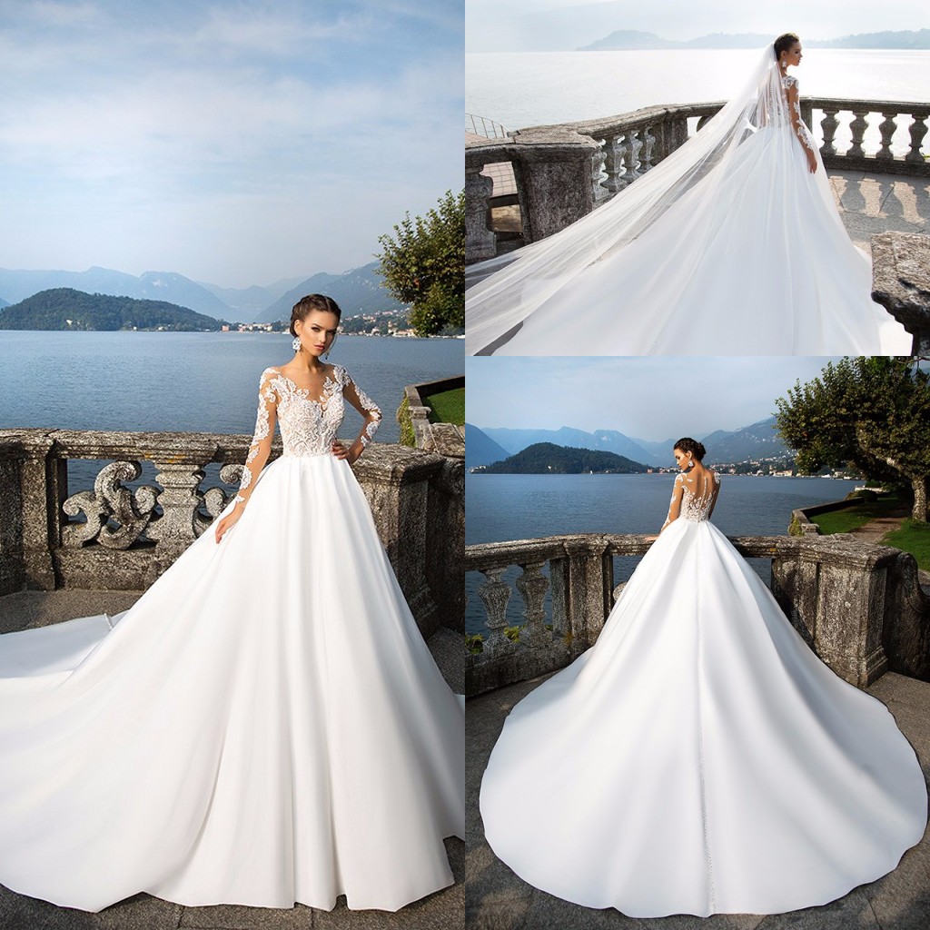

2019 A-Line Lace Tulle Modest Wedding Dresses Sheer Long Sleeves V-Neck Sheer Sleeves Trains Buttons Back Bridal Gowns, Champagne