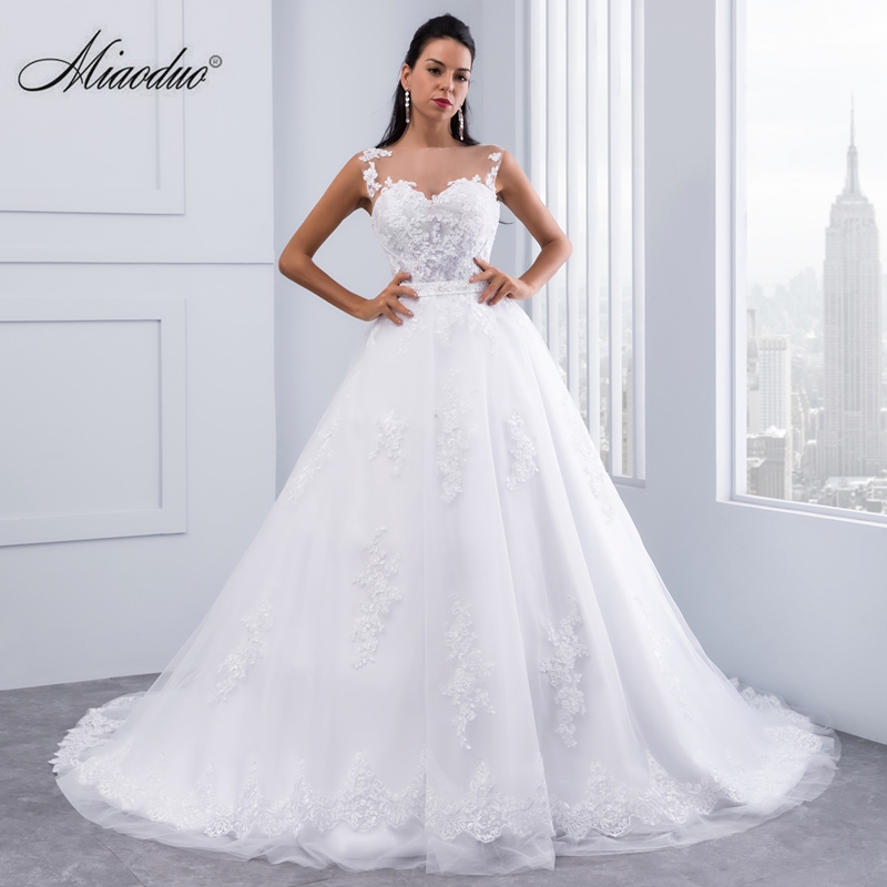 

Sheer Bodice Sleeveless Ball Gown Wedding Dresses 2019 Lace Appliques Sleeveless Bridal Gowns Crystal Sashes Wedding Gowns Vestido De Novias, Pink