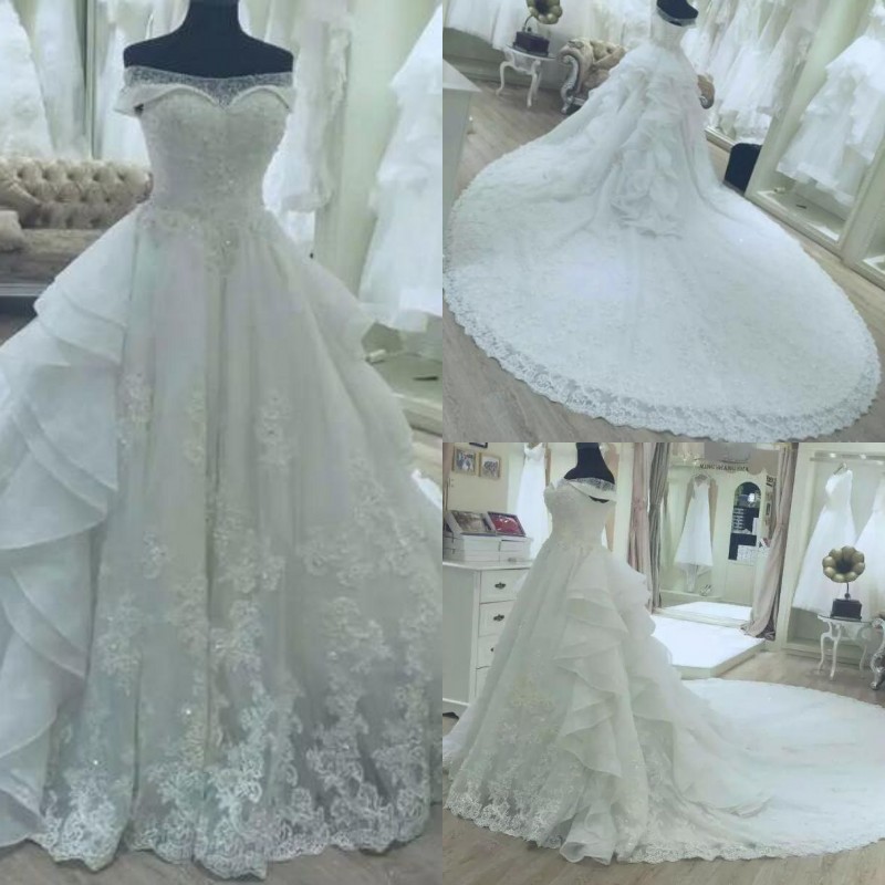 

Luxury 2017 Ivory Off The Shoulder Lace Appliqued Beaded Wedding Dresses Modest Ruffles Long Cathedarl Train Bridal Gowns Custom EN8093, Same as image