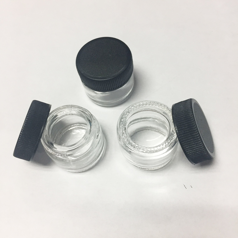 

Food Grade Non-Stick 5ml Glass Jar Tempered Glass Container Wax Dab Jar Dry Herb Container with Black Lid VS 6ml Glass Jar