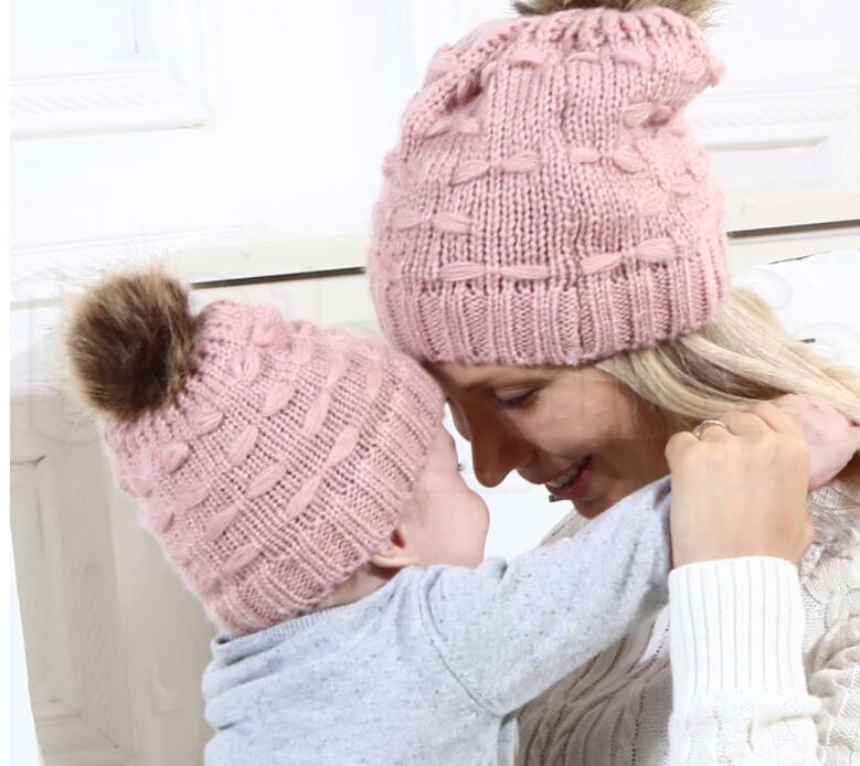 mother and baby matching bobble hats