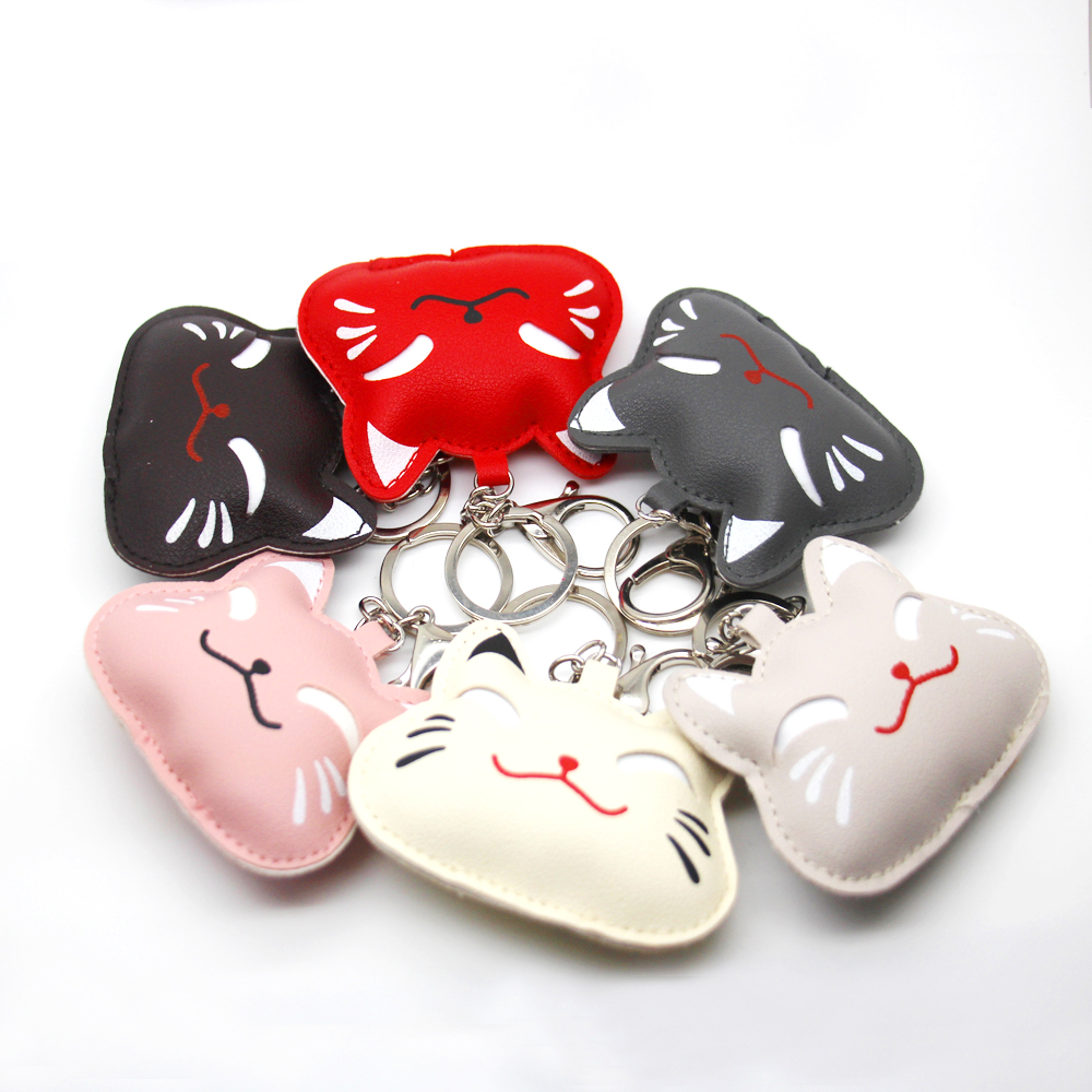 

The latest fashion design cute cat PU leather pendant plus key chain holiday commemorative gift key chain wholesale