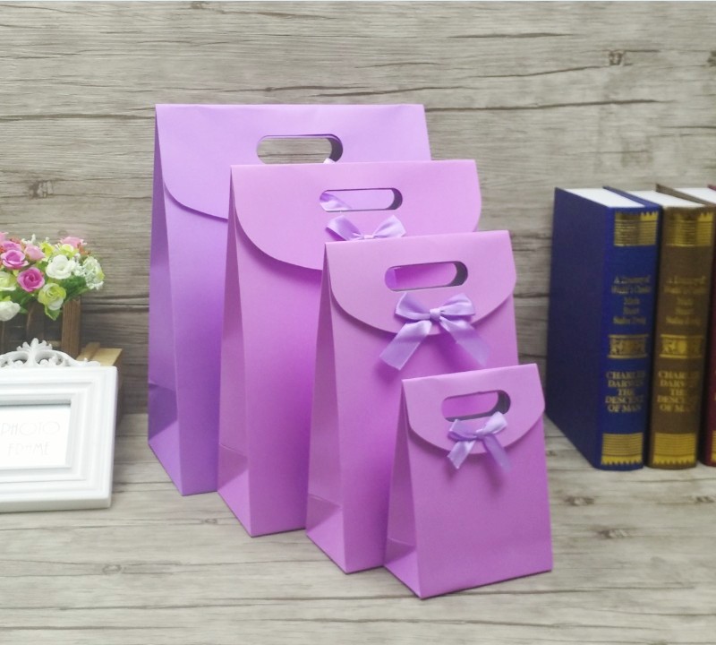 

2018 purple color small gift fashionable packaging advertising paper bag with bow tie