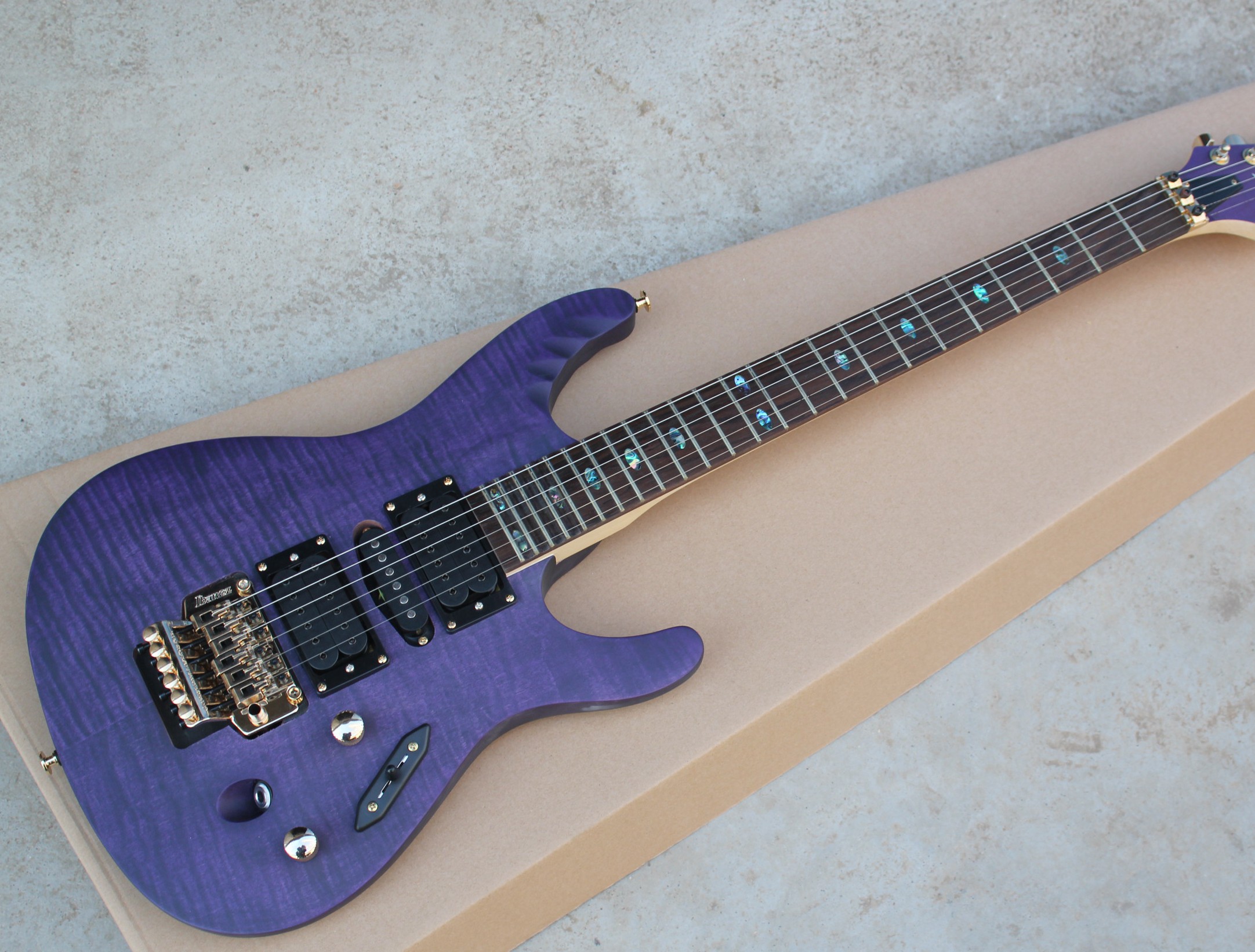 

Super Thin Herman Li EGEN18 Flame Maple Top Trans Purple Electric Guitar Floyd Rose Tremolo Bridge, Abalone Oval Inlay, HSH Pickups, Gold Hardware