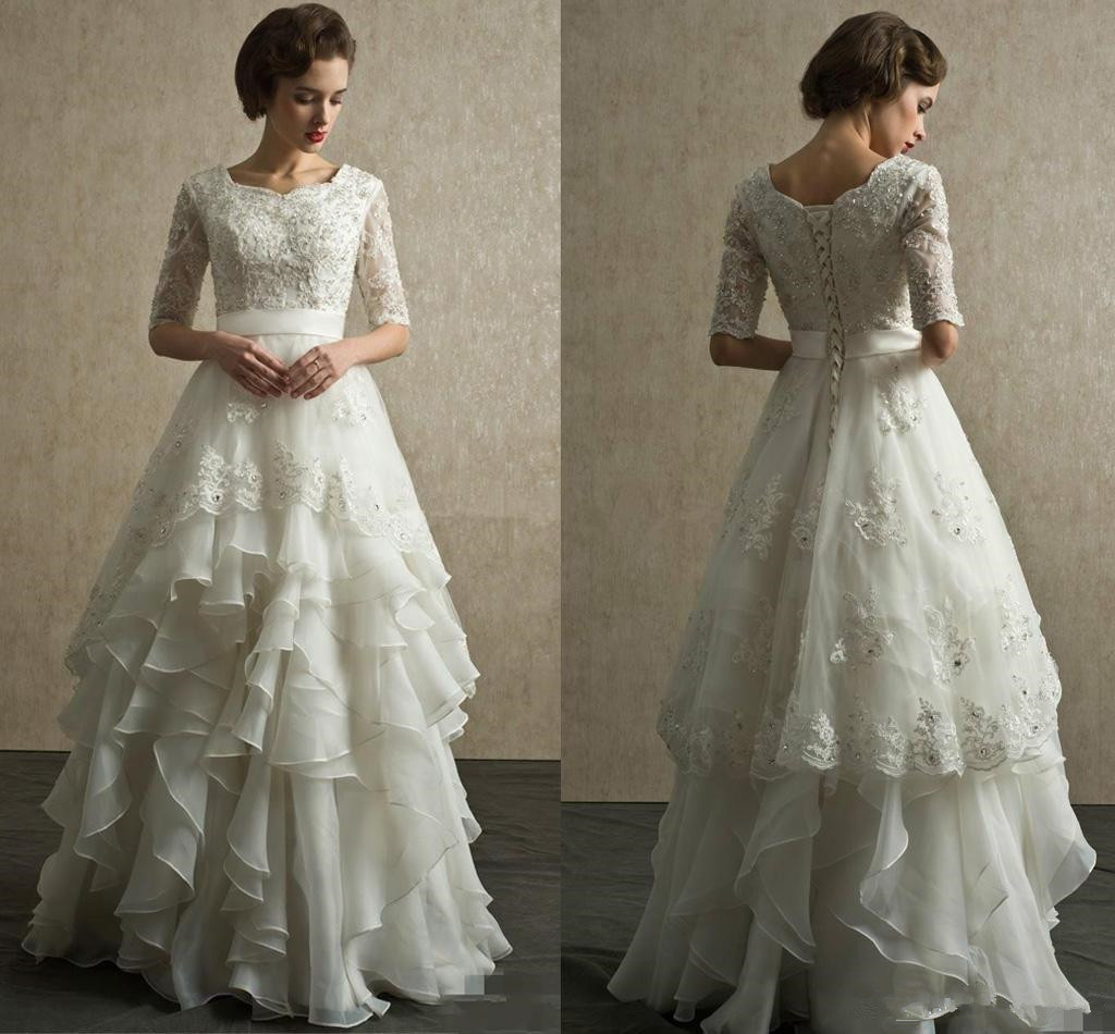Robes de mariée en dentelle modeste demi-manches 2019 vente chaude nouvelle longueur de plancher personnalisé A-ligne perlé cristaux volants robe