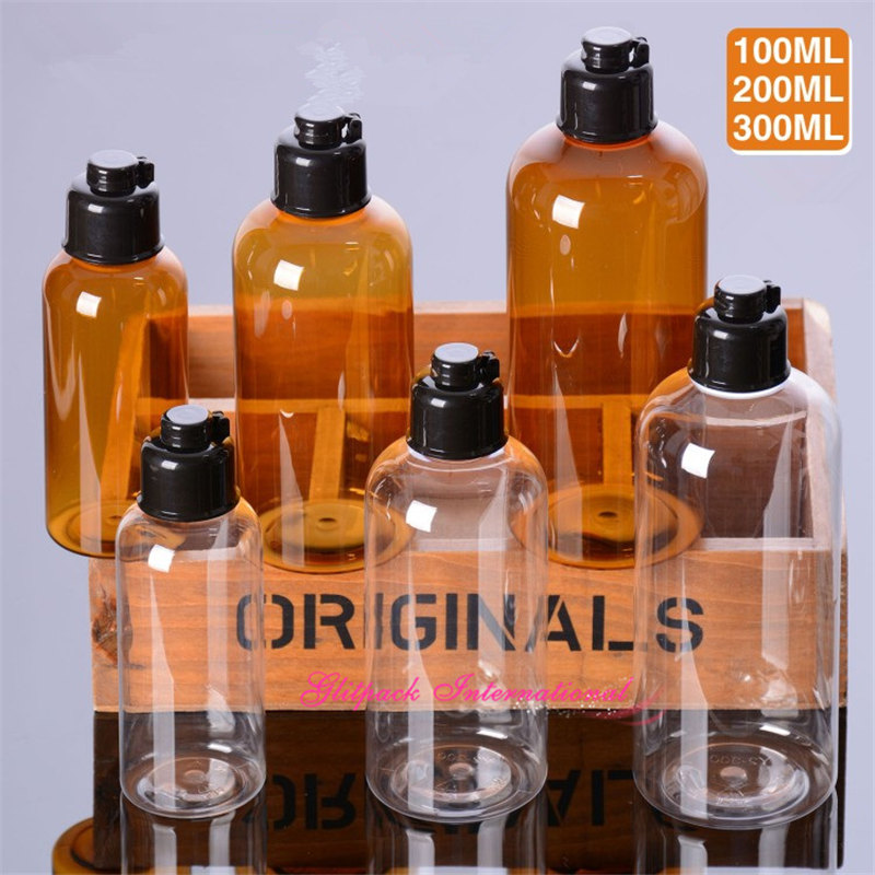 

30pcs/lot High quality 100ml 200ml 300ml Clear/Amber Cosmetic Bottles liquid Black Flip Top luxury cosmetic PET plastic bottles