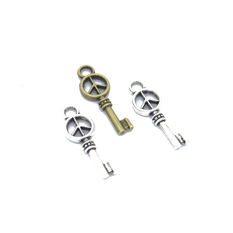 500 Pcs lead and nickel free- 9x26mm antiqued bronze/antiqued silver peace key charms pendant findings-image-425986042