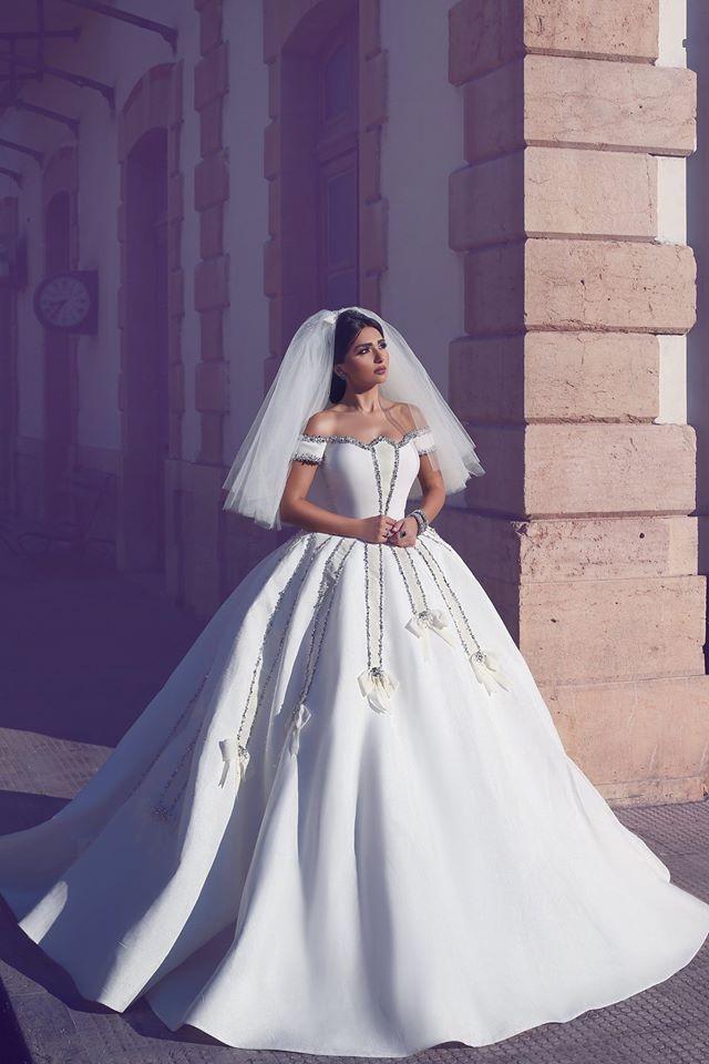 

2018 Arabic Luxury Wedding Dresses Off Shoulder Cap Sleeves Crystal Beading Satin Bow Ball Gown Long Chapel Train Plus Size Bridal Gowns, Ivory