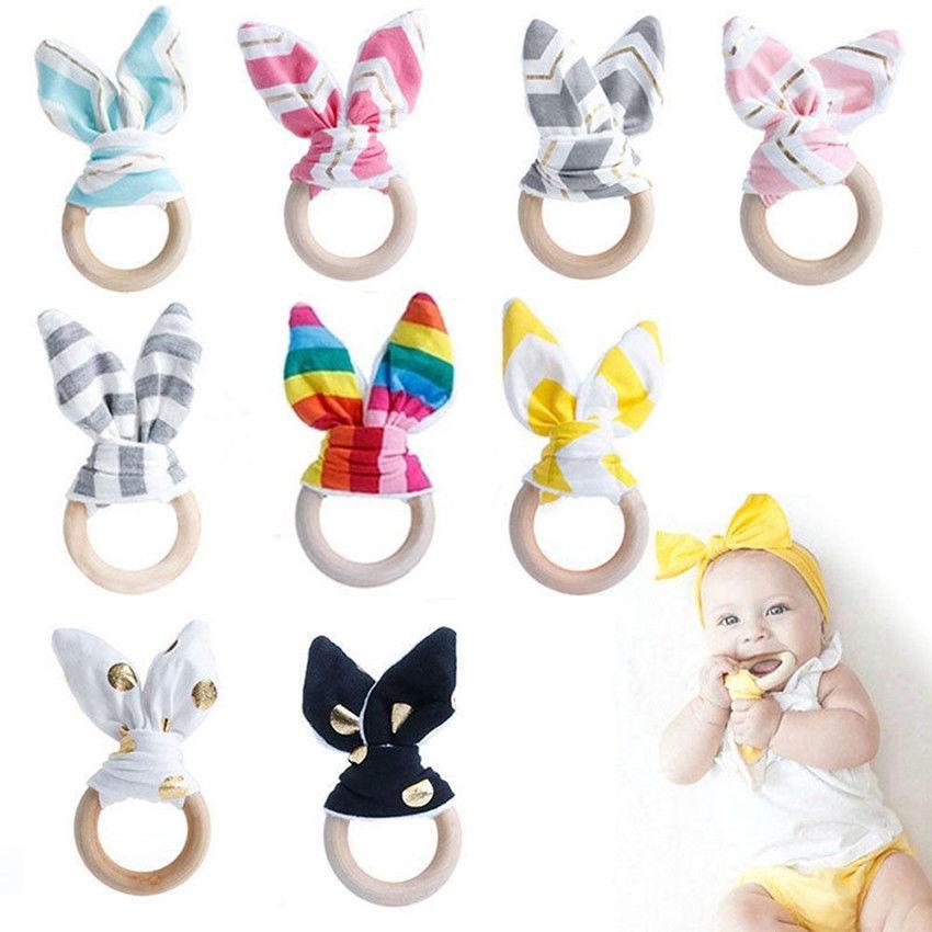 

Wholesale Infant Baby Teethers Teething Ring Fabric Wooden Teething Training Crinkle Material Inside Sensory Toy Natural Teethers Bell