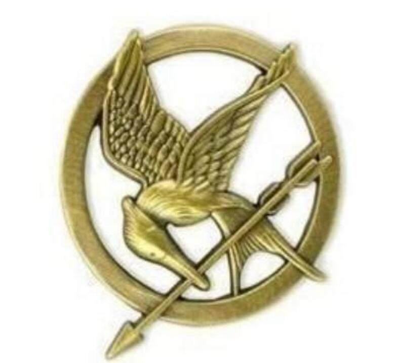 

Hot Movie The Hunger Games Mockingjay Pin Gold Plated Bird and Arrow Brooch Gift