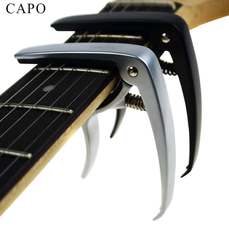 

Nueva guitarra acústica y guitarra eléctrica capo plata y negro modelos opcionales de aluminio guitarra partes Accesorios