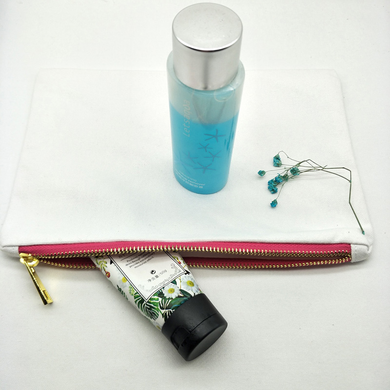 White bag with pink-gold zip