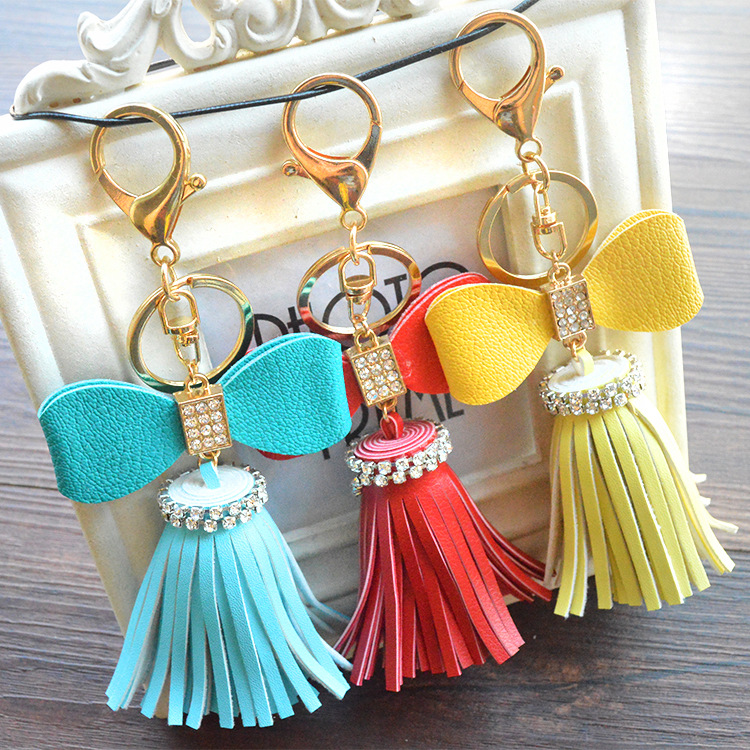 

New Creative Diamond Bowknot Flower Tassel Keychain Car Key Ring Bag Pendant 9 Colors Available PU Material Superman Keychain, Silver