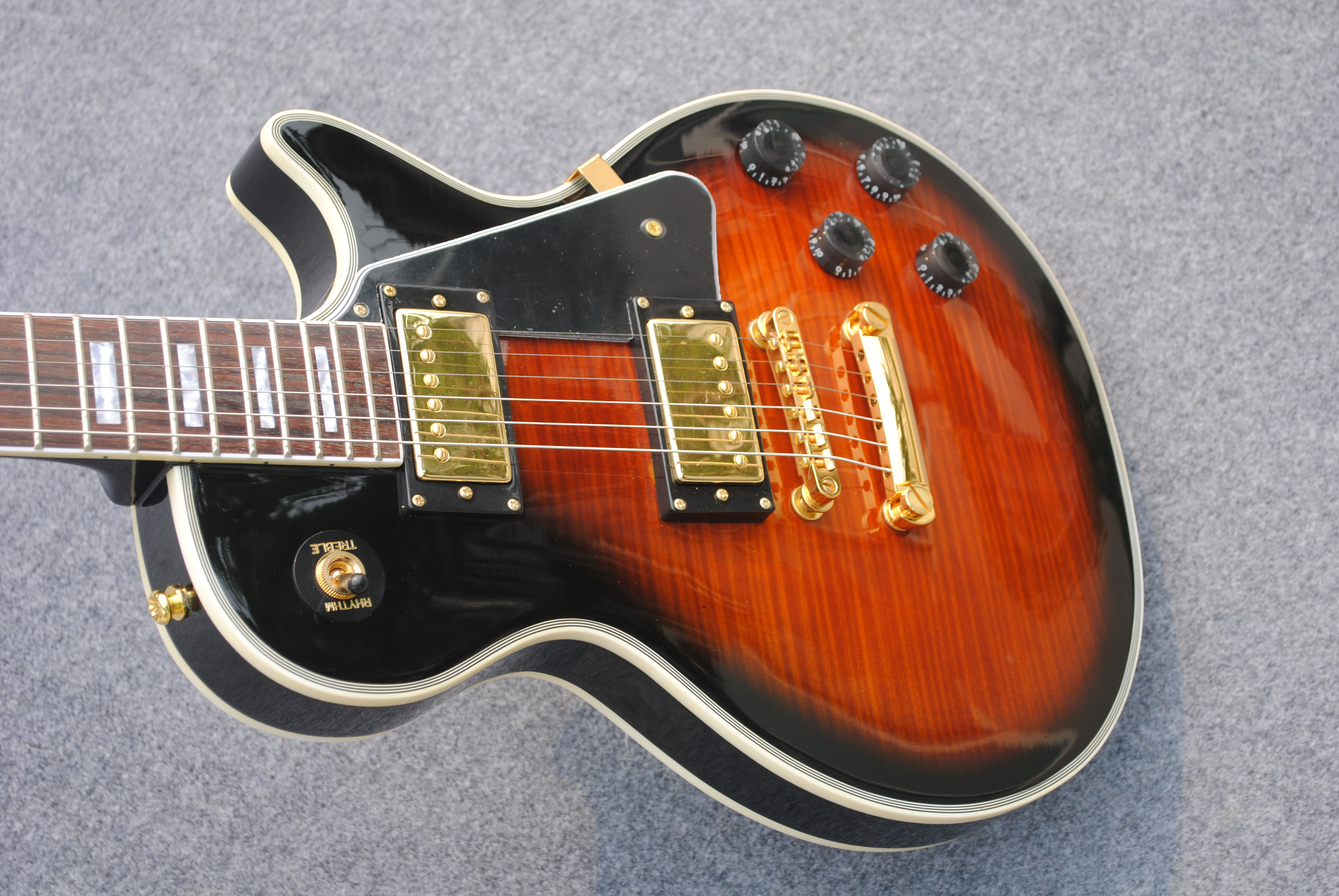 Wholesale high quality custom 1960 electric guitar,tiger flame top guitarra.Rosewood fingerboard. Gold hardware . Sunburst.