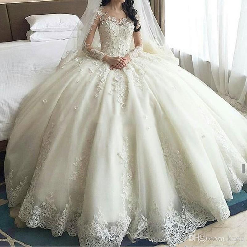 

Modest Princess Wedding Dresses 2019 Luxury Lace Applique Beaded Jewel Neck Long Sleeve Bridal Gowns Puffy Tiered Skirt Arabic Wedding Dress, Ivory