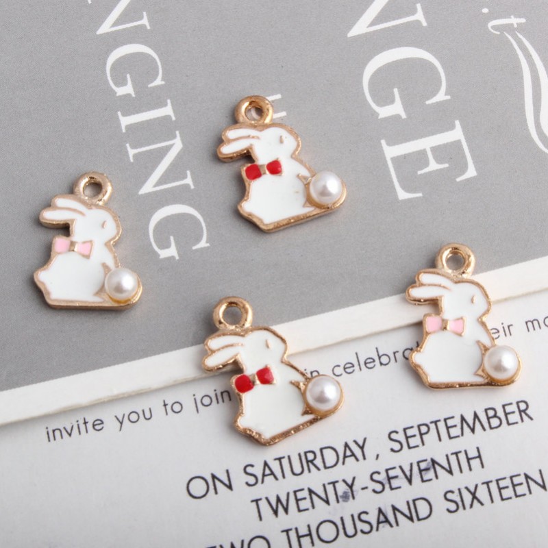 

Bulk 120pcs Enamel white Rabbit bunny charms pendant with a white pearl tail good for craft making