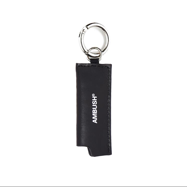 

Ambush Simple accessories for men and women with black letters and leather retro lighter leather case key buckles, Slivery;golden