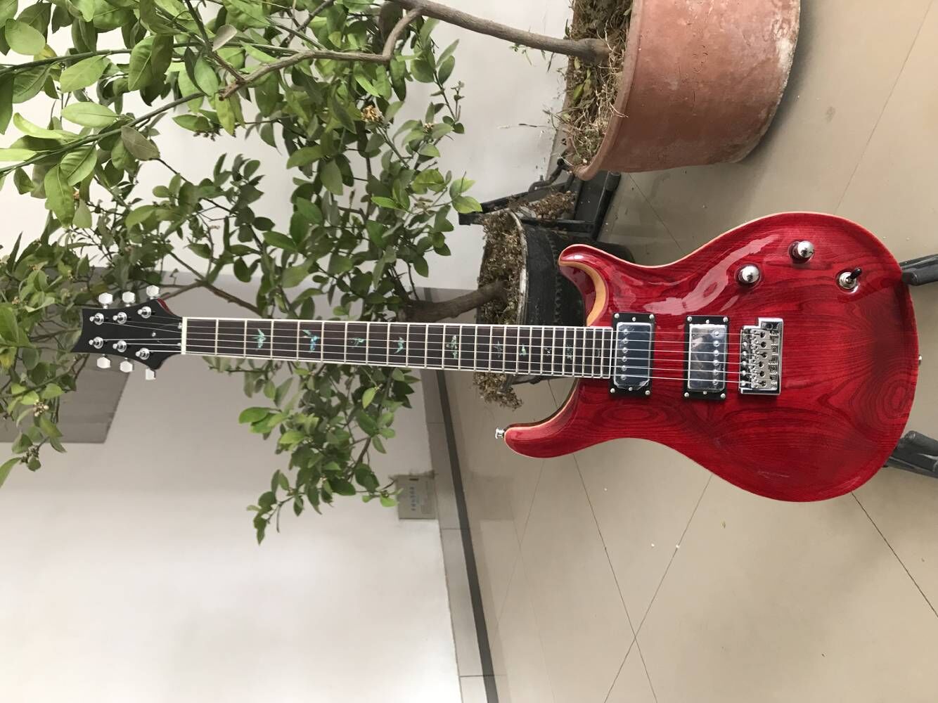 

Custom Reed Smith Crimson Red Ash Top Electric Guitar Rosewood Fingerboard Abalone Birds Inlay, Natural Wood Binding, Double Locking Tremolo