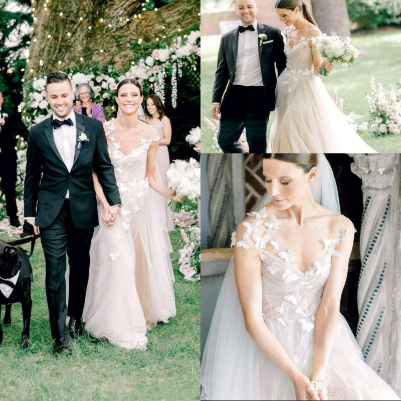 white wedding dress with purple butterflies