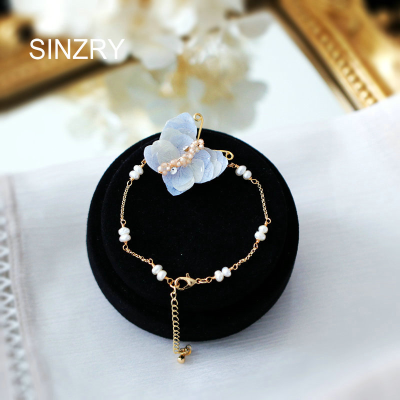 

SINZRY original Korean stylish natural pearl preserved petal butterfly charm bracelets