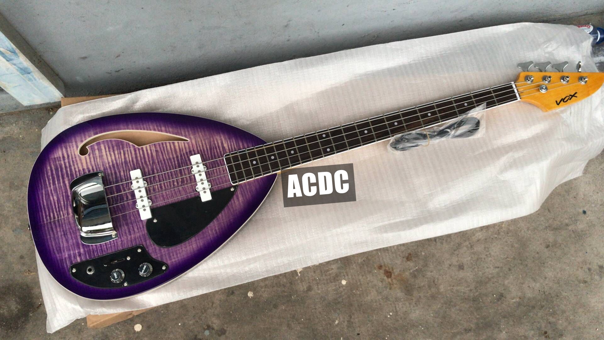 

4 Strings Trans Purple Flame Maple Top Tear Drop Vox Phantom Electric Bass Guitar Semi Hollow Body, Single F hole, Chrome Tailpiece Cover